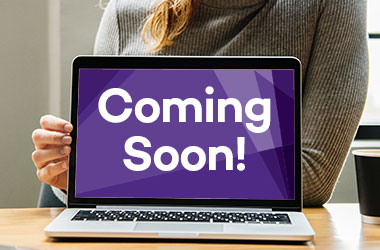 Image of a laptop screen with the words "coming soon"