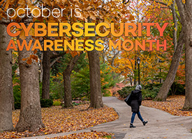 Student walking across Evanston campus in the fall