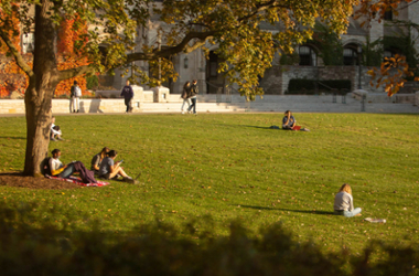 students on campus looking at various hand-held devices