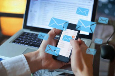 Image of person forwarding emails from cell phone