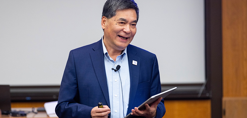 Xuemao Wang, dean of libraries and Charles Deering McCormick university librarian, addresses the Northwestern IT staff.