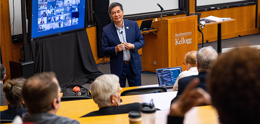 Xuemao Wang, dean of libraries and Charles Deering McCormick university librarian, addresses the Northwestern IT staff.