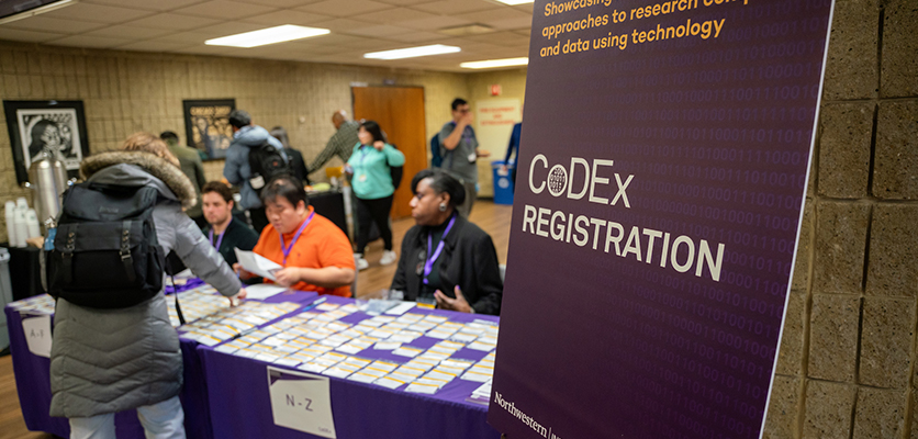 CoDEx attendees pick up their name tags to prepare for the morning workshop sessions hosted by Research Computing and Data Services at Norris University Center.
