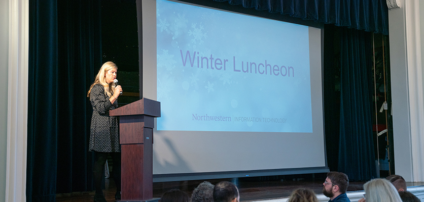 Kate Leech, coordinator of special events, welcomes everyone to the luncheon and explains what is planned for the afternoon.