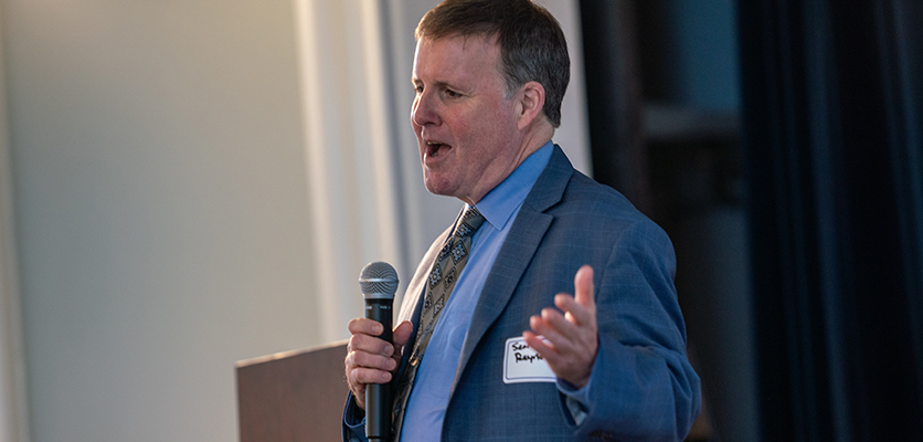 Sean Reynolds, vice president for information technology and chief information officer, addresses the staff.