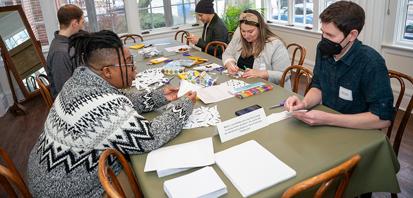 During the dessert hour, a room was set aside to create cards for local senior living housing facilities. 