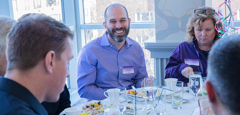 Northwestern IT staff gather at the Halim Time & Glass Museum in Evanston for the organization's annual winter celebration.