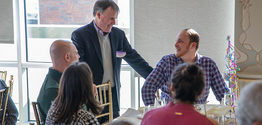 Vice President and Chief Information Officer Sean Reynolds visiting with colleagues. 