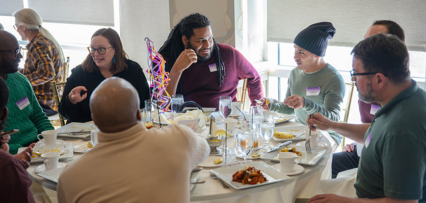 Northwestern IT staff gather at the Halim Time & Glass Museum in Evanston for the organization's annual winter celebration.