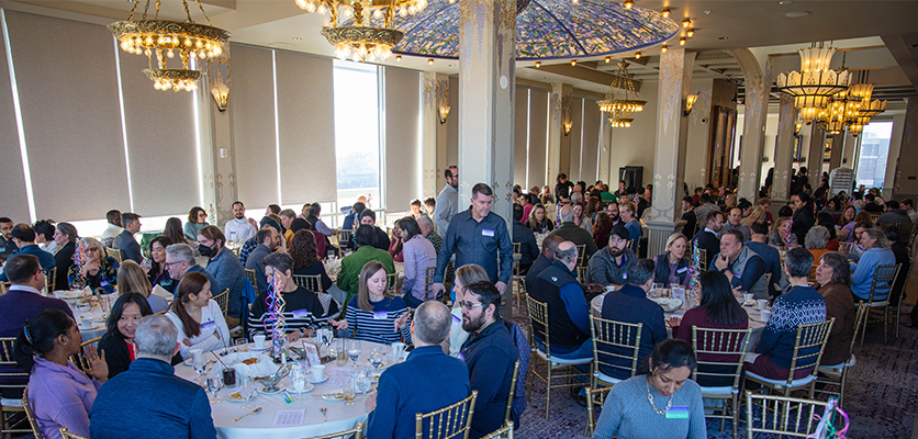 Northwestern IT staff gather at the Halim Time & Glass Museum in Evanston for the organization's annual winter celebration.