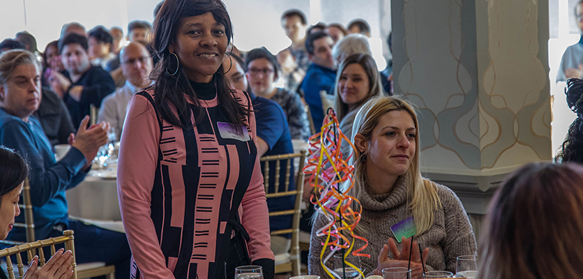 Northwestern IT staff gather at the Halim Time & Glass Museum in Evanston for the organization's annual winter celebration.