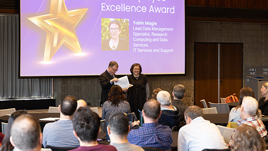 Employee Excellence Award winner, Tobin Magle with COO, Sean Reynolds