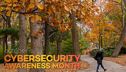 Student walking across Evanston campus in fall