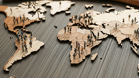 Global population represented by people on a wooden world map