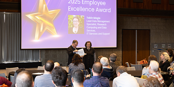 Employee Excellence Award winner, Tobin Magle with COO, Sean Reynolds